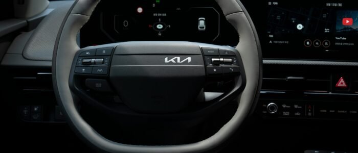 Ev charger supplier and manitannace servisces Close-up view of the Kia EV's steering wheel showcasing its modern design and technology.